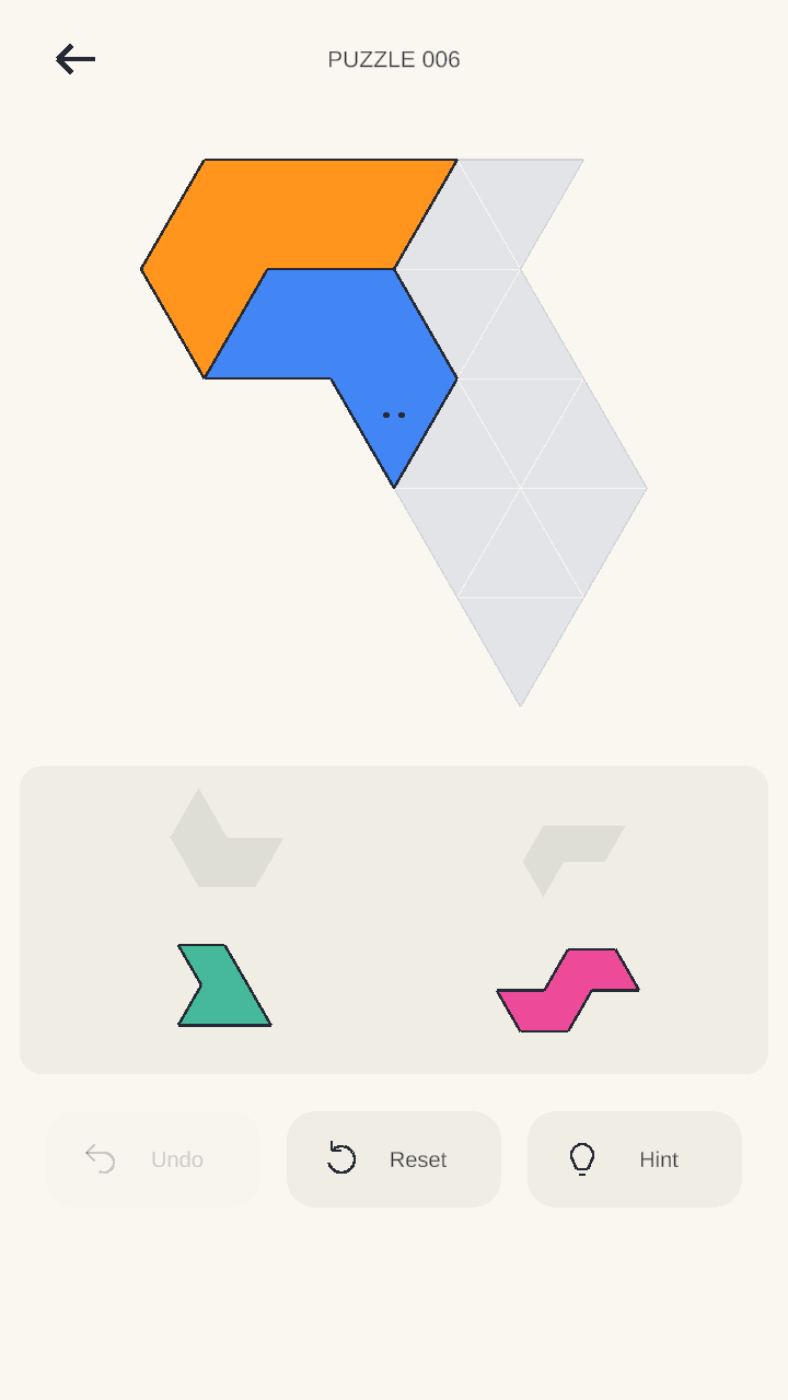 Oddly Fits gameplay: colourful pieces, an angular puzzle board and Undo, Reset and Hint controls